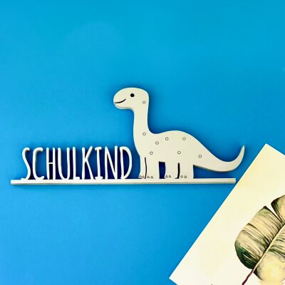 Schulkind mit Dinosaurier