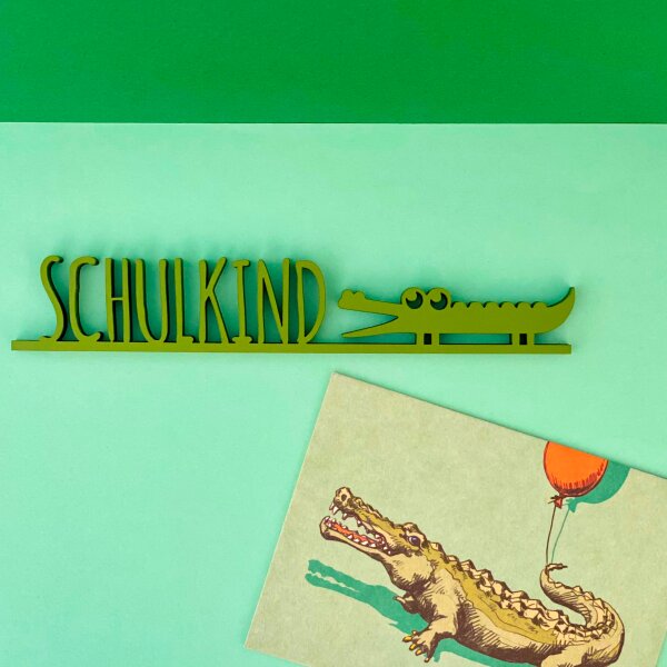 Schulkind mit Krokodil