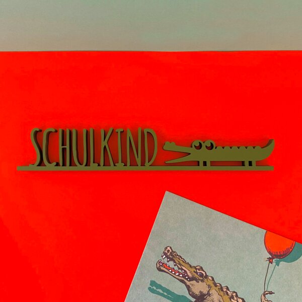 Schulkind mit Krokodil