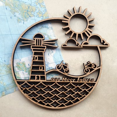 Phare et mer avec texte "ans Meer fahren"
